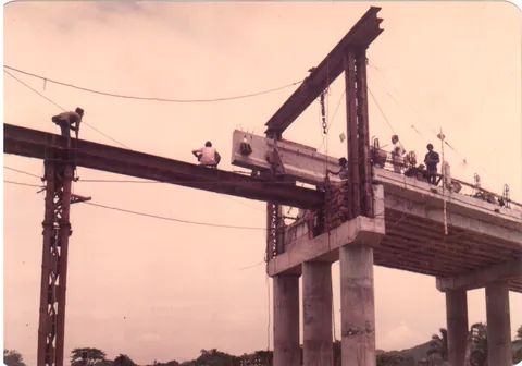 Crane launching a girder along a bridge deck