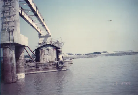Bridge girders in place across a river channel