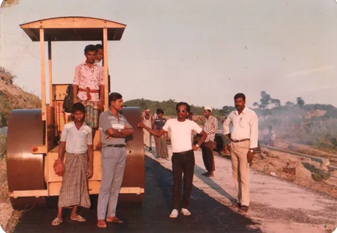 Road roller and crew on a newly formed road